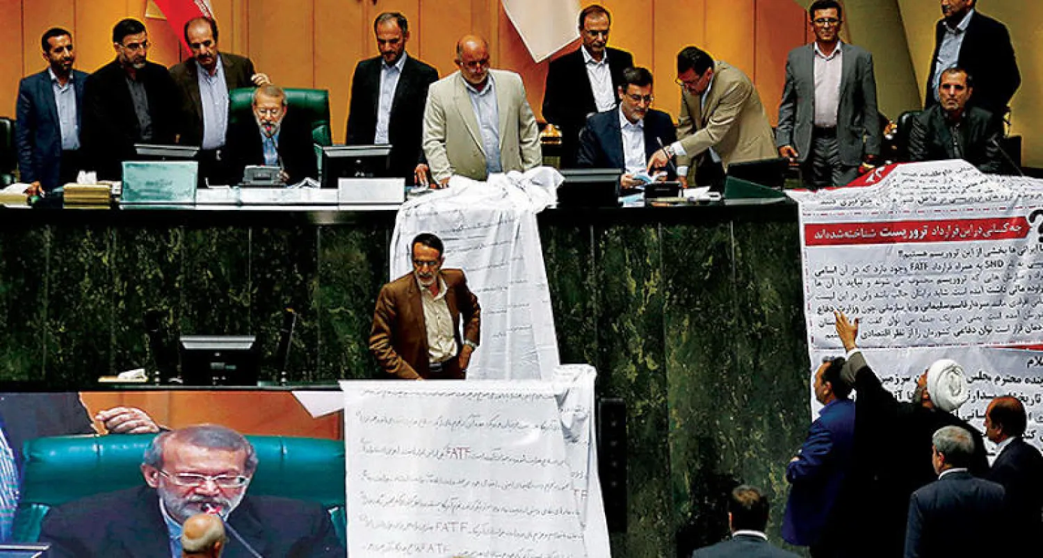 نواب البرلمان الإيراني أثناء جلسة التصويت  على تعطيل قانون اتفاقية منع تمويل الإرهاب في يونيو الماضي (ميزان)