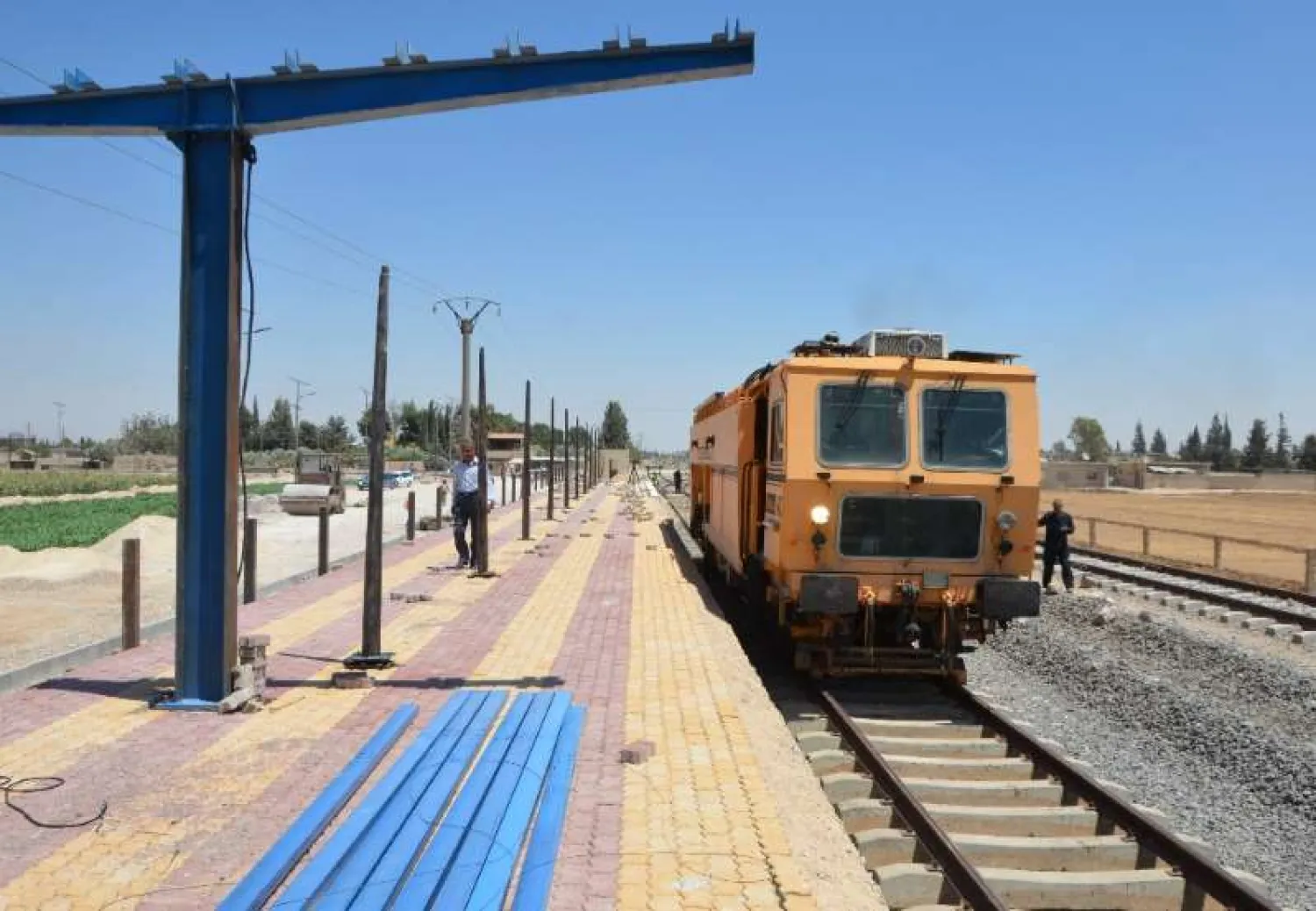 Syrian railroad workers and technicians work on the restoration of the railway in the Syrian capital Damascus. (AFP)