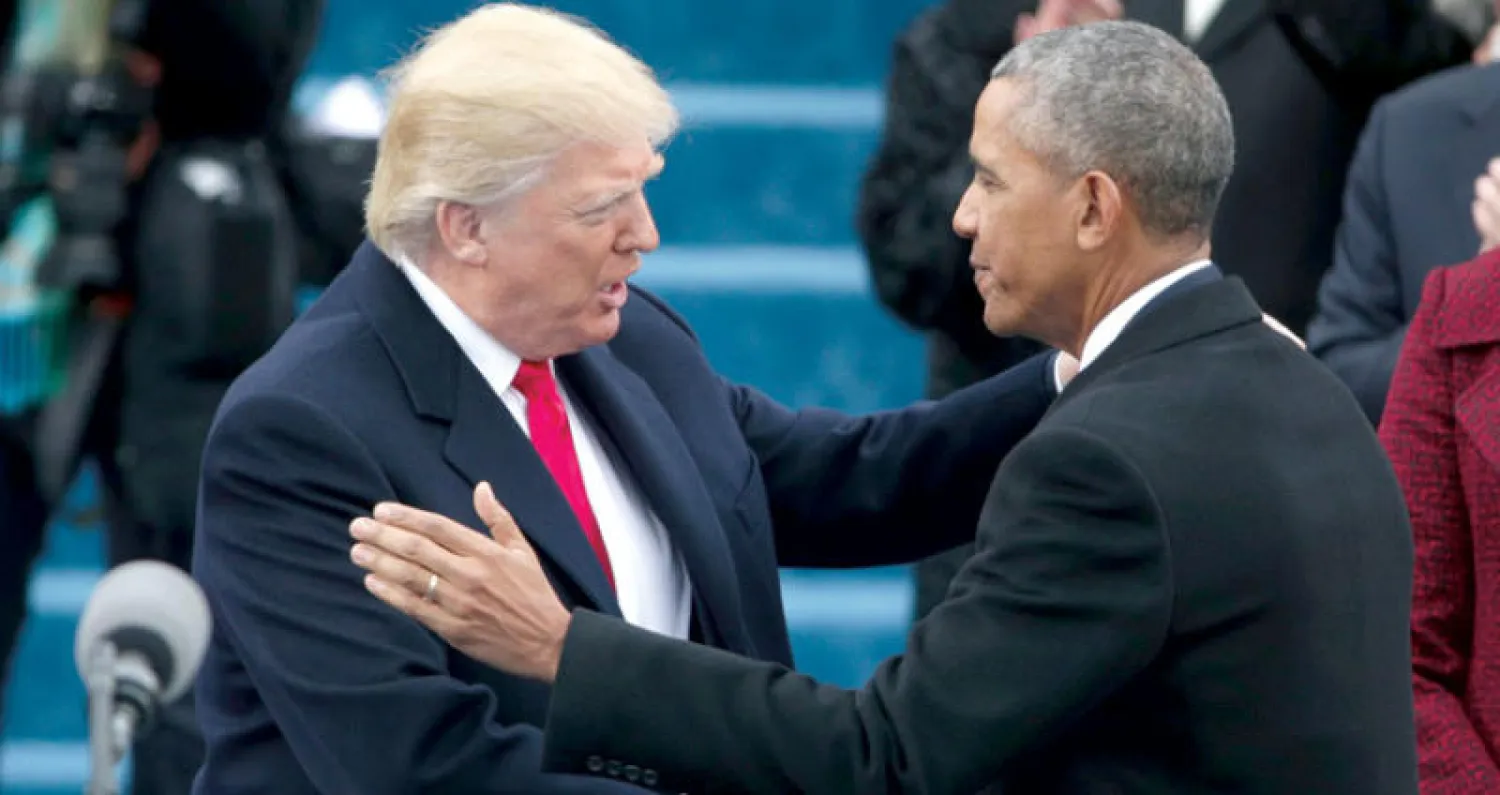 الرئيسان الأميركيان الحالي دونالد ترمب والسابق باراك أوباما بعد أداء ترمب اليمين الدستورية العام الماضي (غيتي)