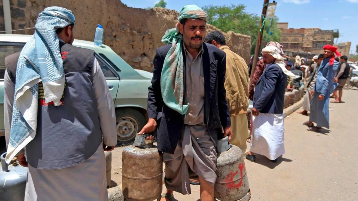 Yemenis fill gas cylinders in the capital Sanaa. (AFP)