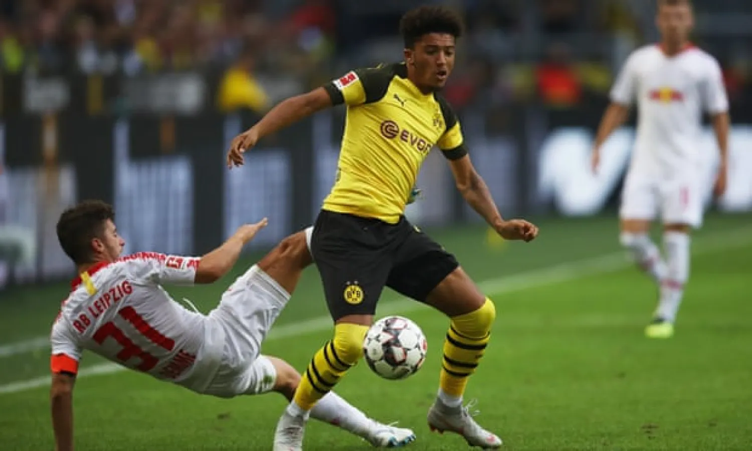  Jadon Sancho of Borussia Dortmund gets the better of RB Leipzig’s Diego Demme. Photograph: Maja Hitij/Bongarts/Getty Images
