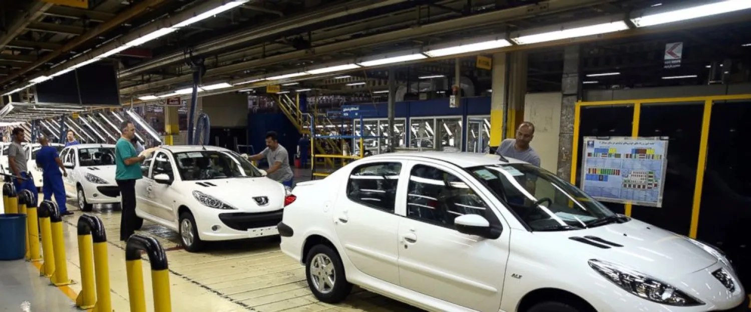 In this Sunday, Sept. 9, 2018 photo, a line of Peugeot cars rolls out at the state-run Iran Khodro automobile manufacturing plant, just outside Tehran, Iran. (AP)