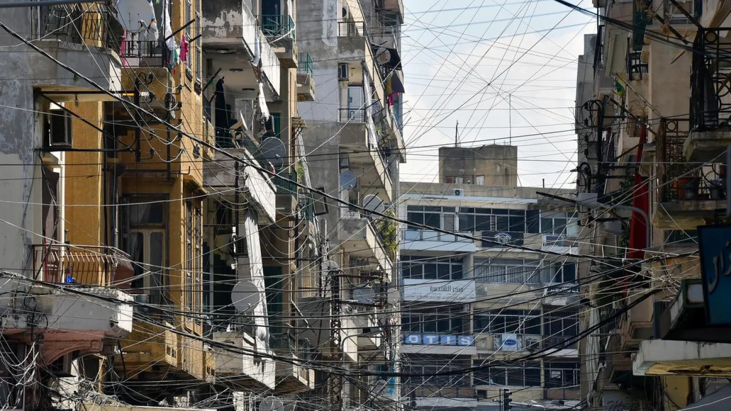Electric wires connected to a generator, which runs when the national power grid is down in one of Tripoli's heavily populated neighborhoods, north Lebanon, 30 July 2018 EPA