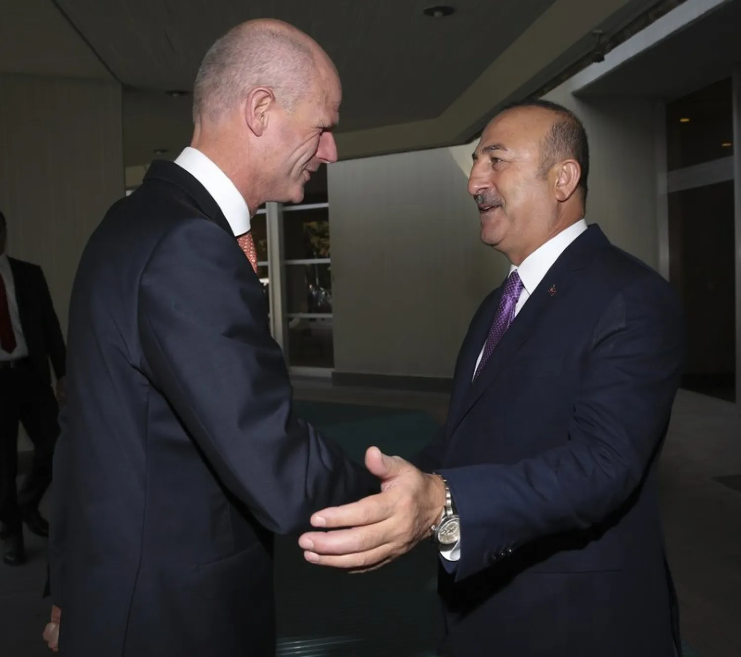 Turkey's Foreign Minister Mevlut Cavusoglu, right, greets Dutch Foreign Minister Stef Blok, left, prior to their meeting in Ankara. (AP)