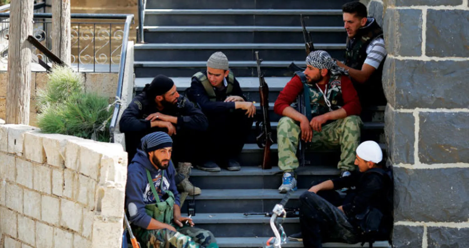 شباب من السويداء جنوب سوريا في استراحة أعقبت جولتهم على بلدة رامي الخميس الماضي (أ.ب)