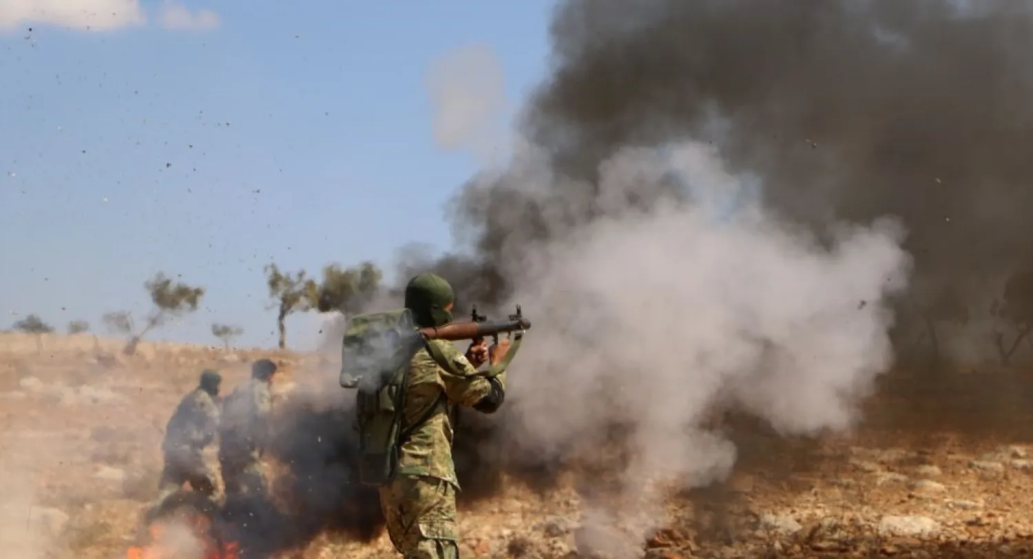 The National Liberation Front said the withdrawal of heavy arms from the Idlib buffer zone will take several days. (AFP)