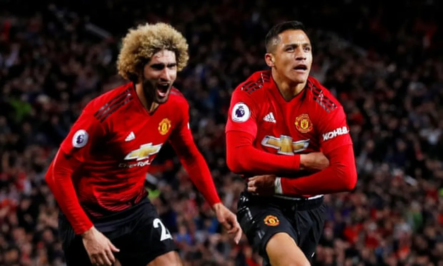  Alexis Sánchez, right, celebrates scoring Manchester United’s third goal against Newcastle United together with Marouane Fellaini. Photograph: Phil Noble/Reuters
