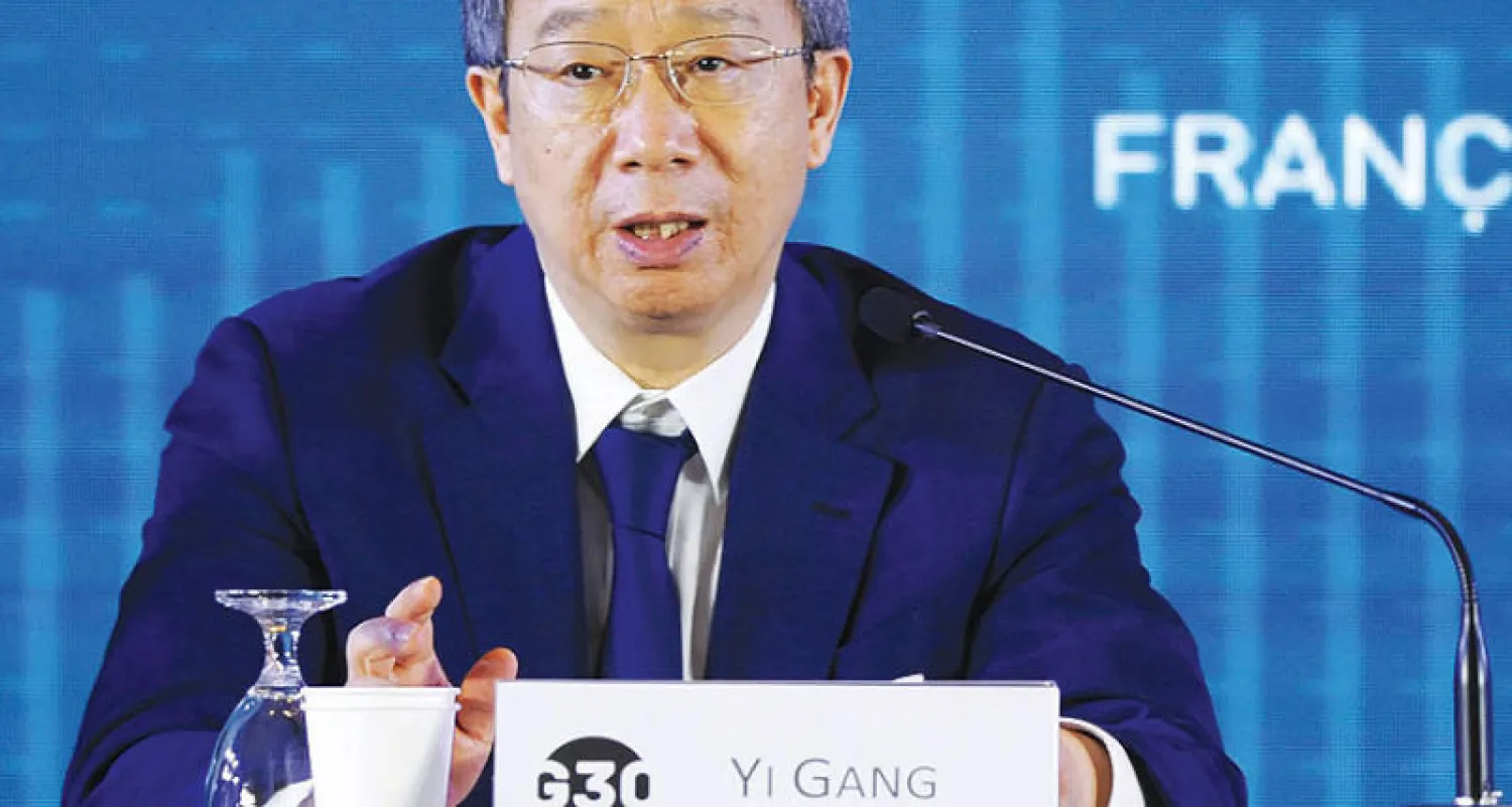 محافظ البنك المركزي الصيني خلال ندوة لحكام مصارف مركزية ومسؤولين كبار جرت في بالي أمس (أ.ف.ب)