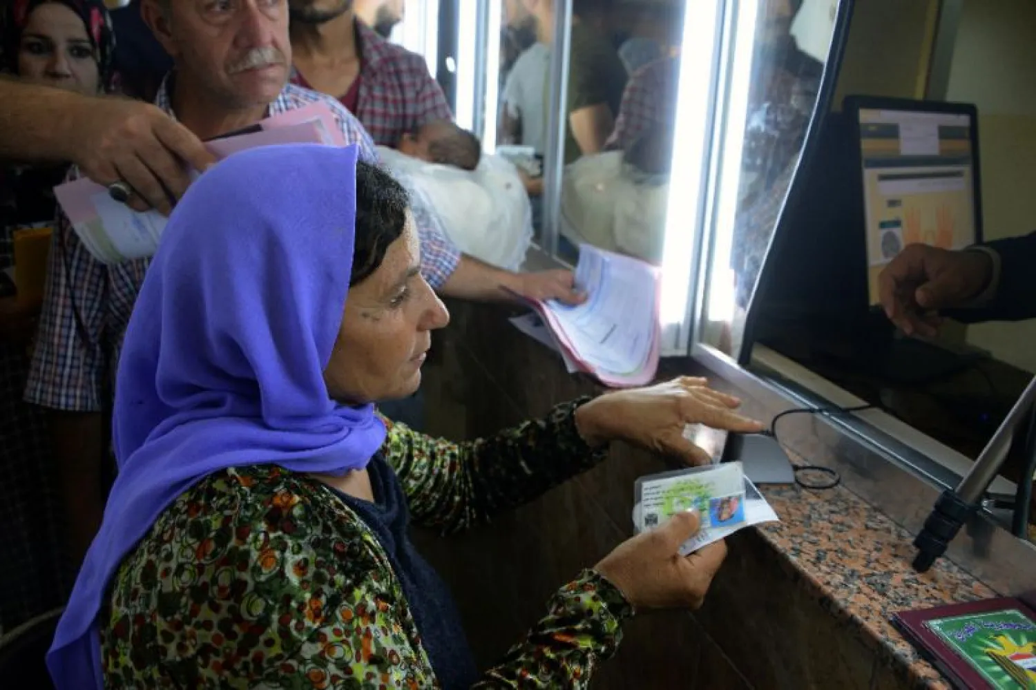 There has been massive demand for official documents since Mosul's civil registry reopened. (AFP)