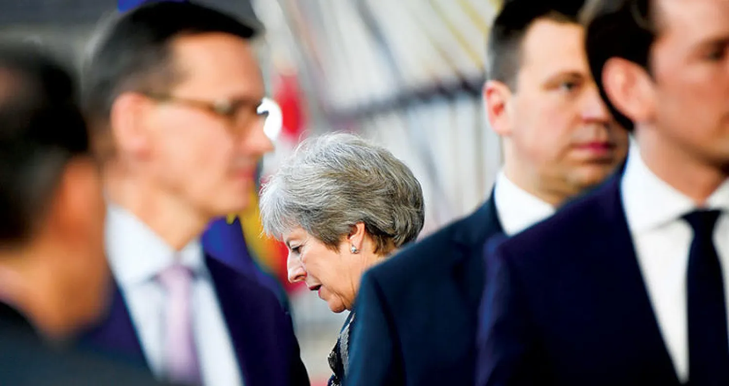 ماي في بروكسل (رويترز)