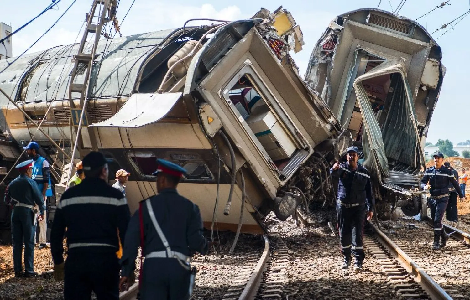 Moroccan rescue teams work through the wreckage of a train crash north of Rabat on October 16, 2018. (AFP)