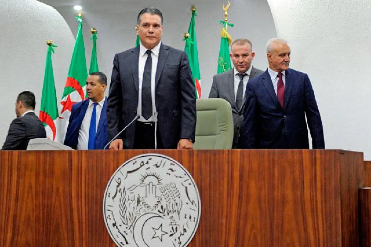 National Liberation Front’s member and newly elected president of parliament Mouad Bouchareb stands up at the president’s platform of the Algerian National Assembly on Wednesday (AFP photo)

 
