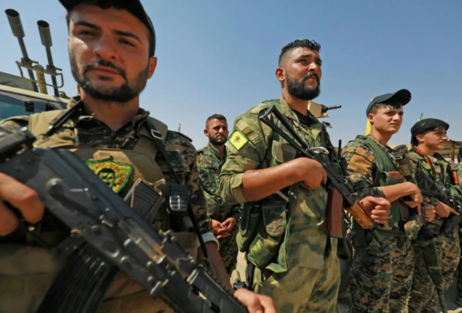 Members of the People's Protection Units (YPG), part of the of the Syrian Democratic Forces (SDF), gather in eastern Syria on September 11, 2018 | AFP