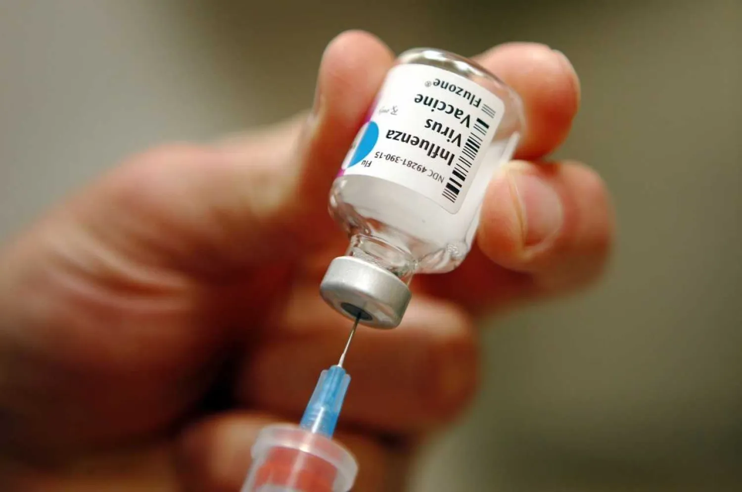 A nurse prepares an injection of the influenza vaccine at Massachusetts General Hospital in Boston, Massachusetts. BRIAN SNYDER /Reuters
