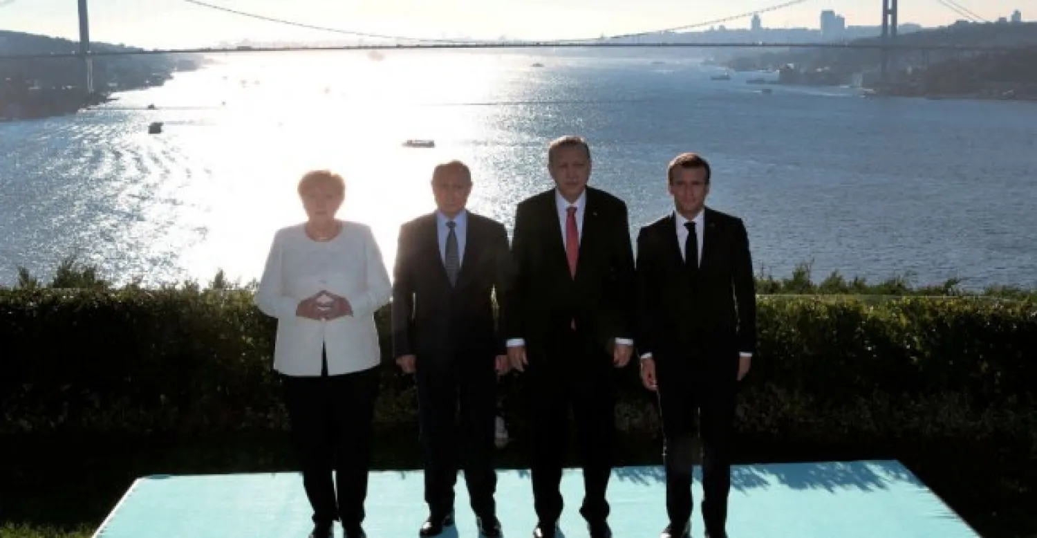 German Chancellor Angela Merkel, Russian President Vladimir Putin, Turkish President Recep Tayyip Erdogan and French President Emmanuel Macron pose for photographers at Vahdettin Mansion in Istanbul on October 27, 2018. (AFP)

