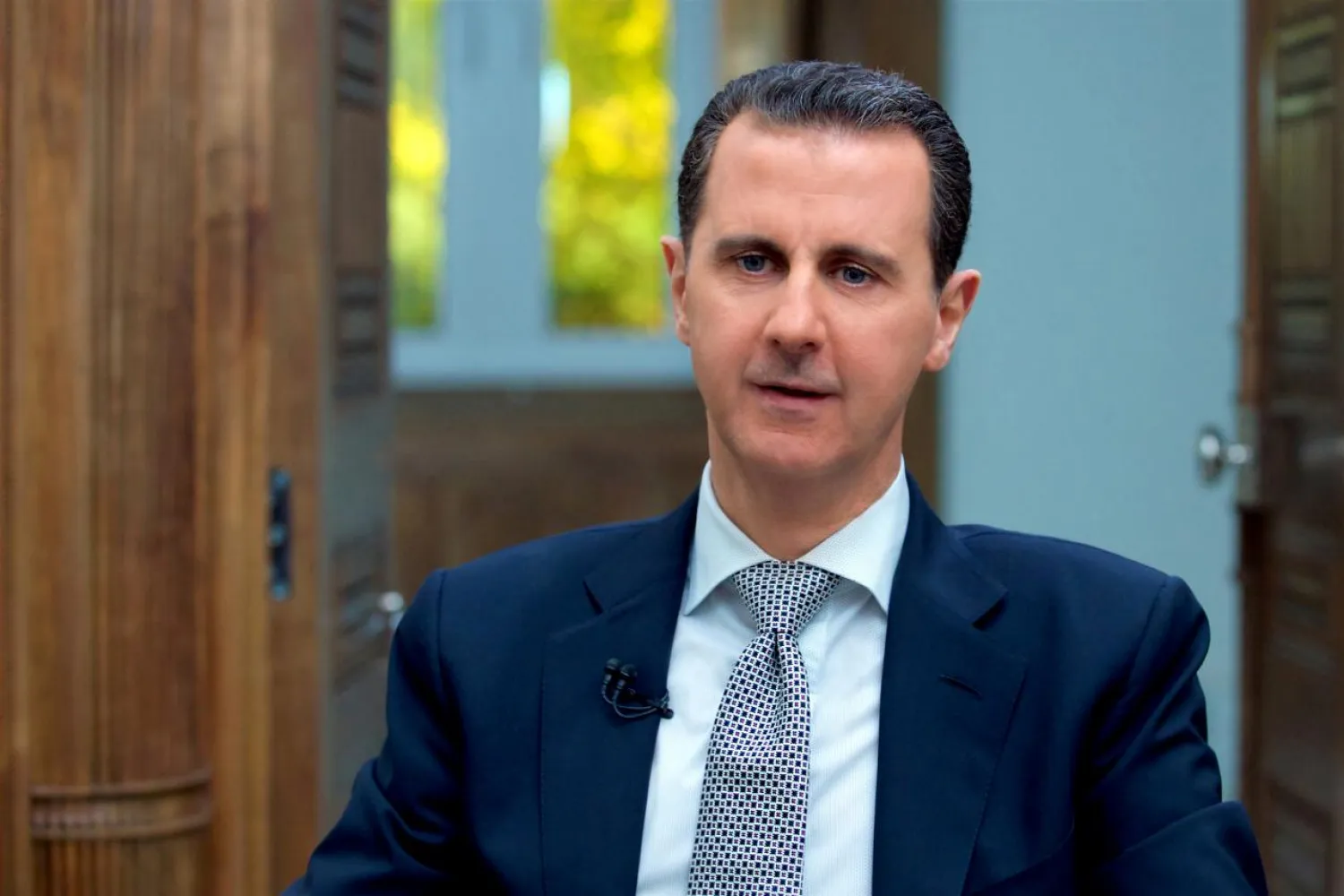 FILE PHOTO: Syria's Bashar al-Assad speaks during an interview with AFP news agency in Damascus, Syria in this handout picture provided by SANA on April 13, 2017. SANA/Handout via REUTERS/File Photo