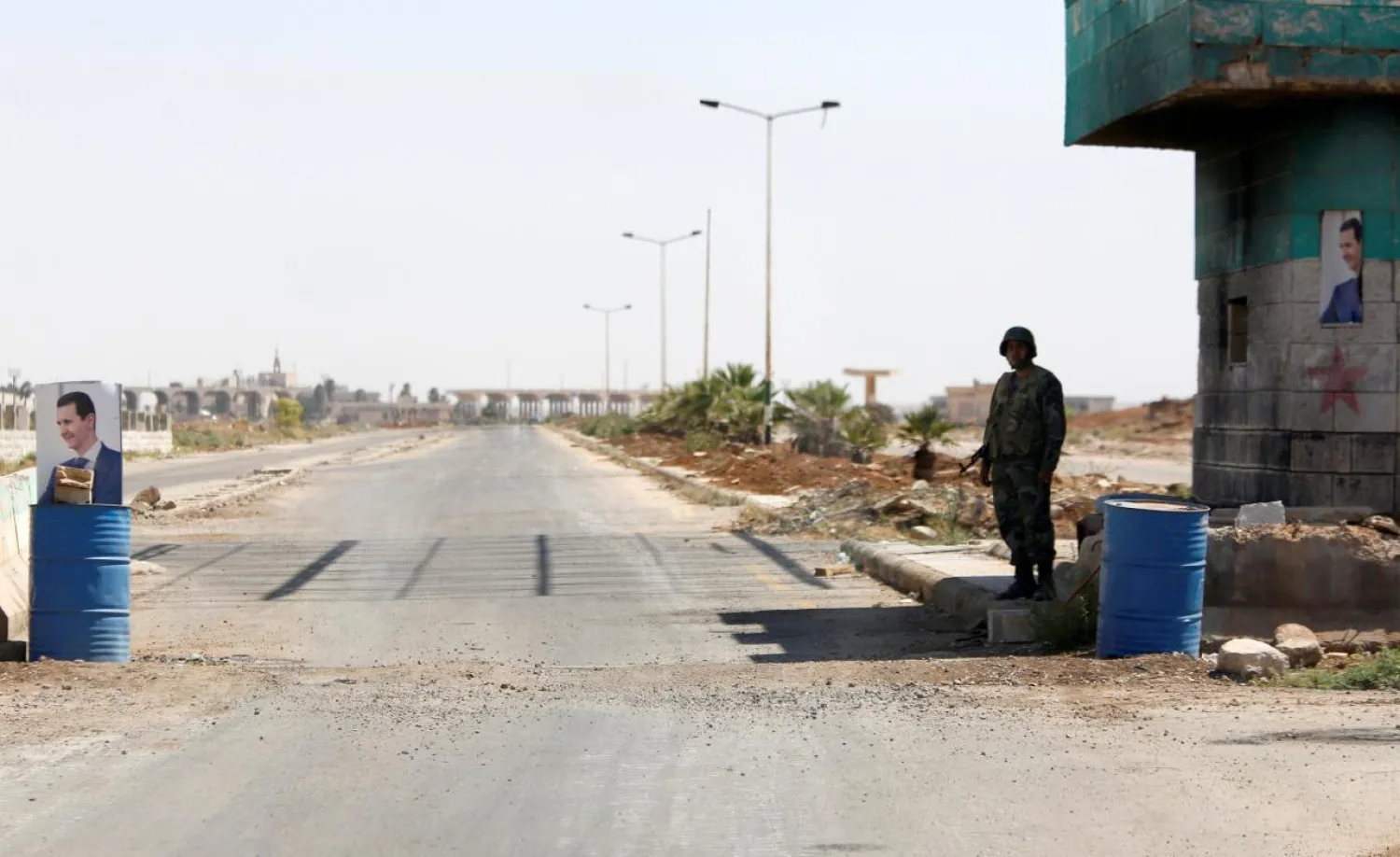 A Syrian soldier stands guard at the Nasib border crossing with Jordan in Deraa, Syria July 7, 2018, Reuters

