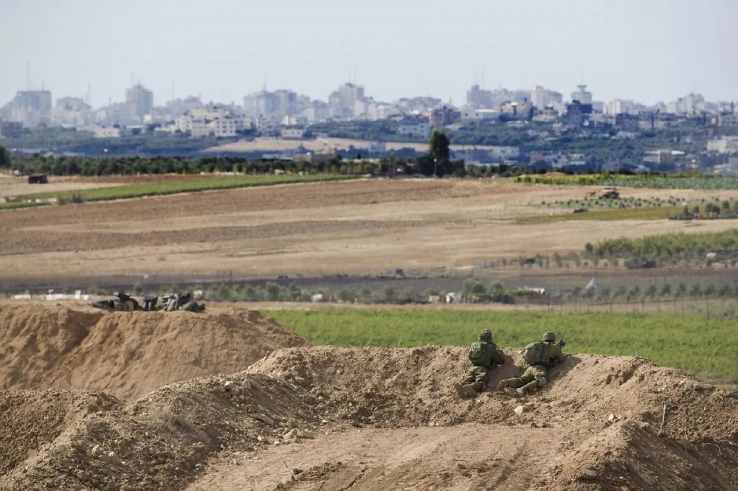 Israeli soldiers observe the Gaza Strip border, Saturday, October 27, 2018. (AP)