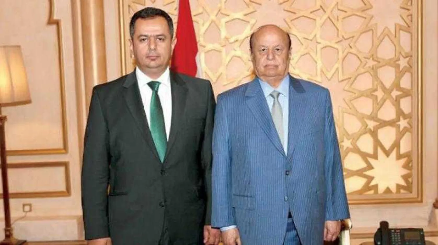 Yemen’s newly appointed Prime Minister Maeen Abdulmalik (L) and Yemeni President Abdrabbuh Mansour Hadi pose for photos in Riyadh (Saba)
