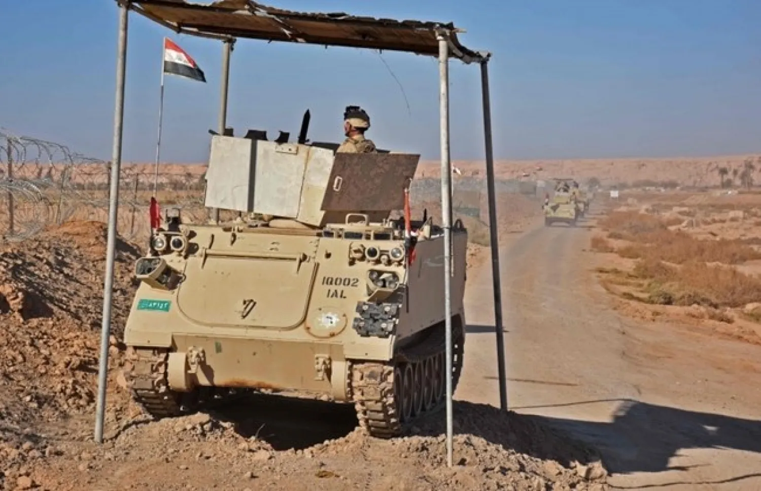 Iraqi forces gather near the al-Qaim border crossing between Syria and Iraq on November 1, 2018. AFP / MOADH AL-DULAIMI