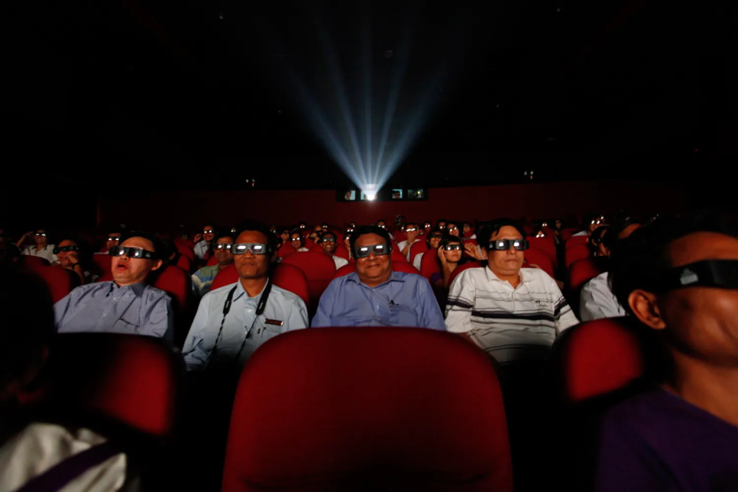 People watch a 3D movie at the newly-opened Minglar cinema in Yangon, Myanmar on April 19, 2012. (Soe Zeya Tun/Reuters)
