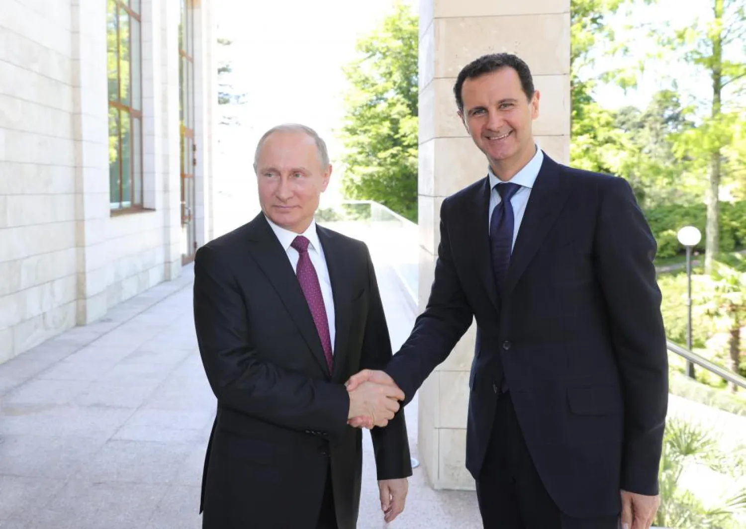 Russian President Vladimir Putin with Syrian President Bashar al-Assad during their meeting in Sochi, May 17, 2018 (Kremlin VIA Reuters)

