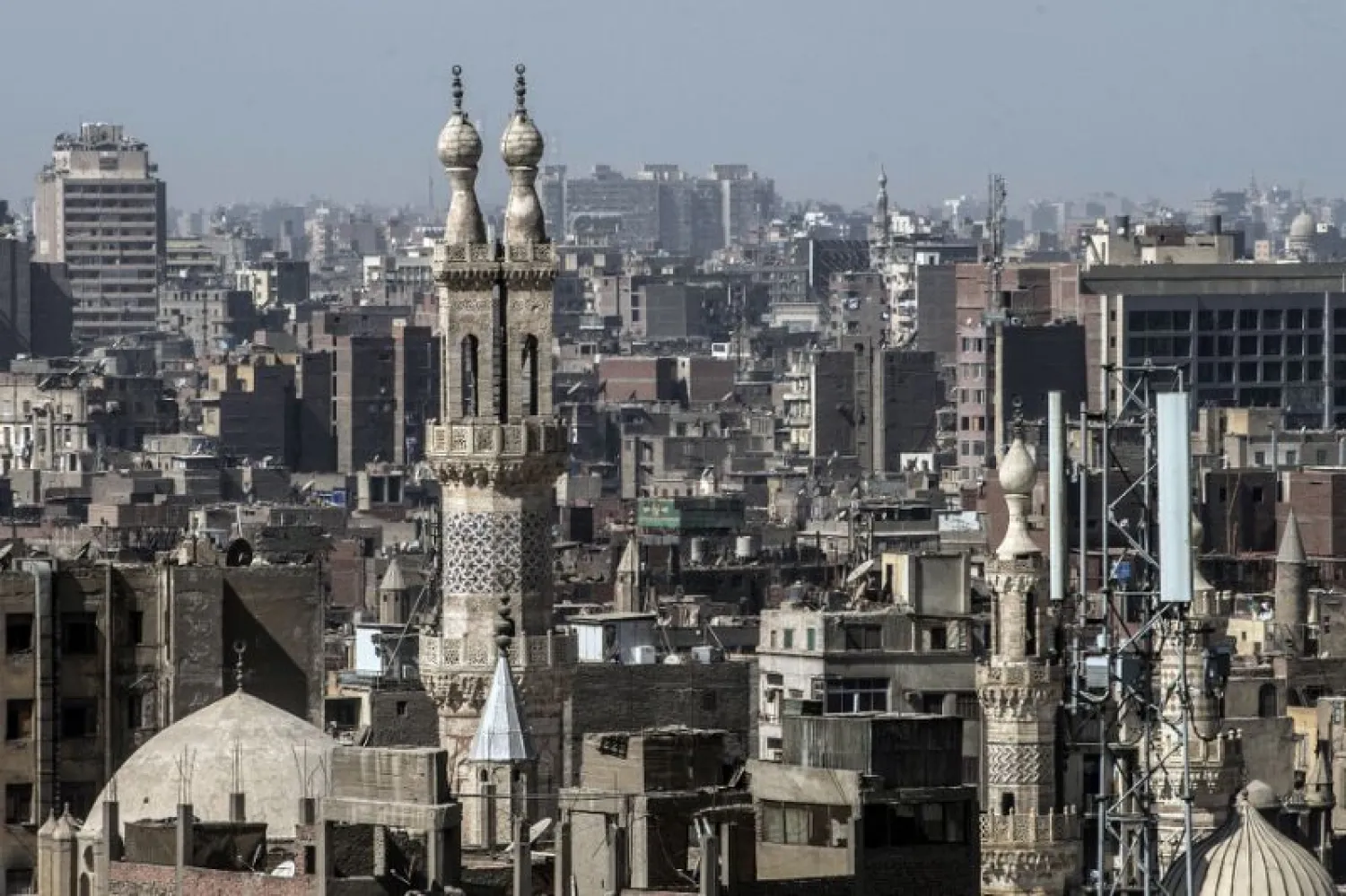 Cairo is packed with ornate monuments, mosques and mausoleums, and its narrow streets are punctuated with trinket shops, cafes and traditional old homes -- an urban fabric layered in centuries of history | AFP