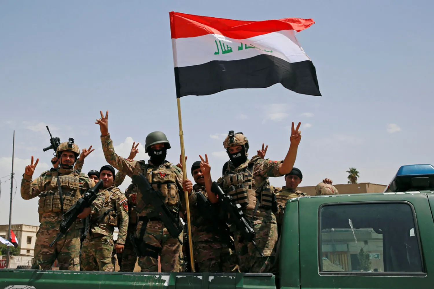 Iraqi forces arrive to take part in a victory celebration after defeating ISIS in Mosul, Iraq July 2, 2017. (Reuters)