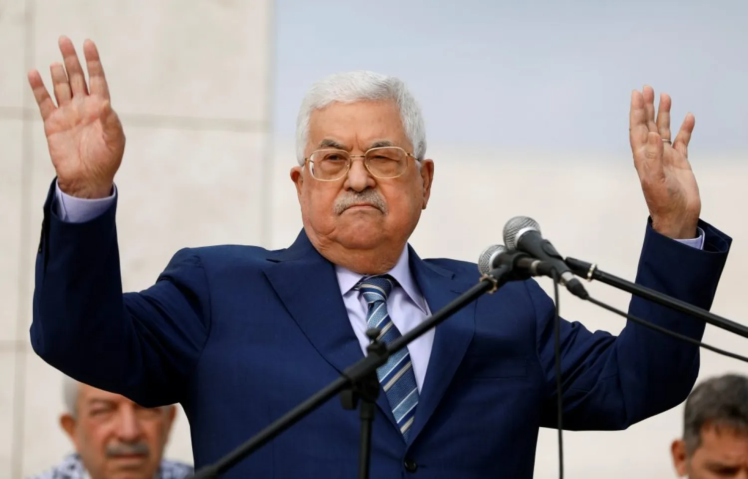 Palestinian President Abbas gestures during a ceremony marking the 14th anniversary of the death of Yasser Arafat in Ramallah, Sunday. (Reuters)
