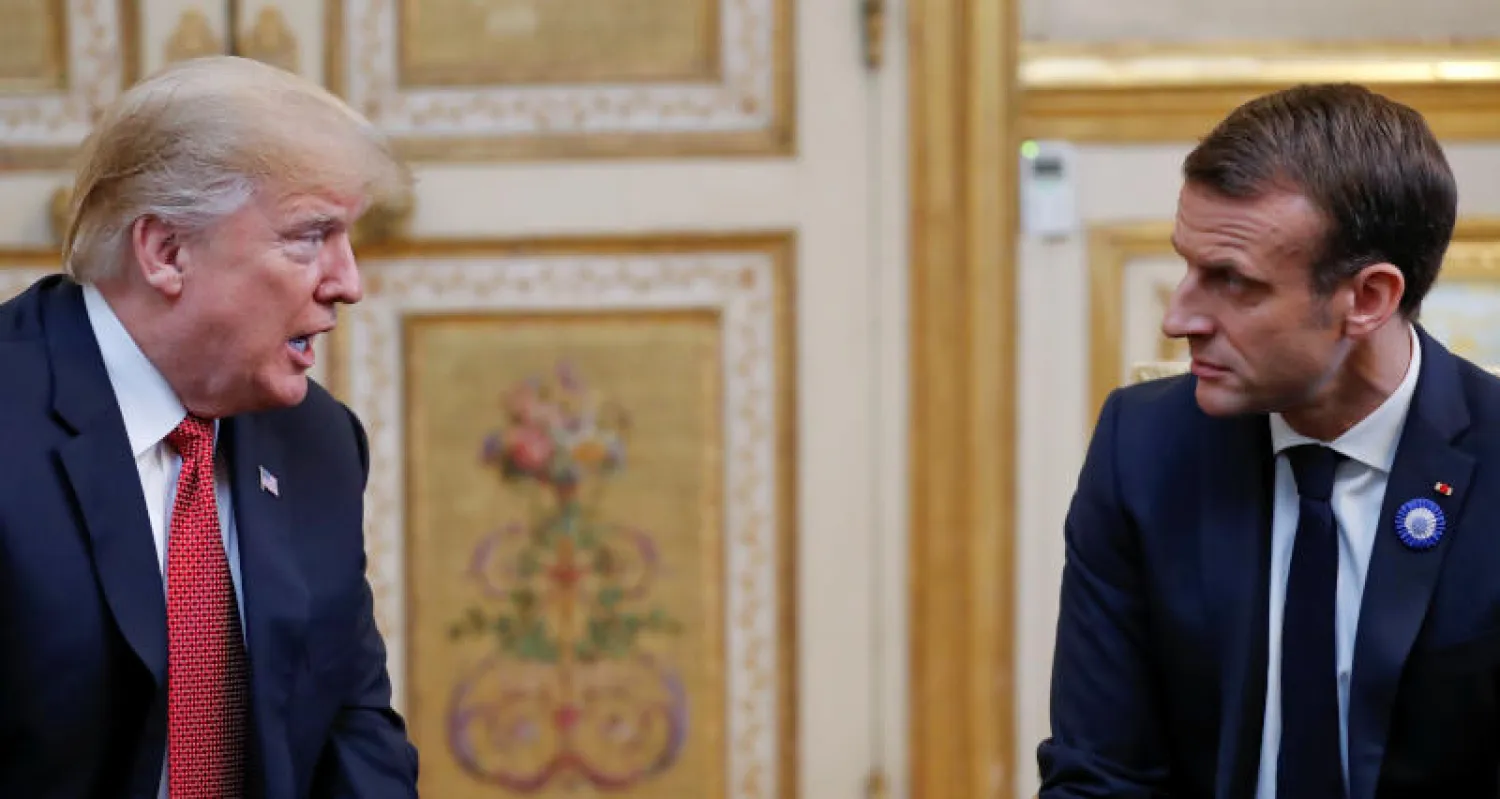 الرئيس الأميركي دونالد ترمب ونظيره الفرنسي إيمانويل ماكرون خلال لقائهما الأخير في باريس (رويترز)