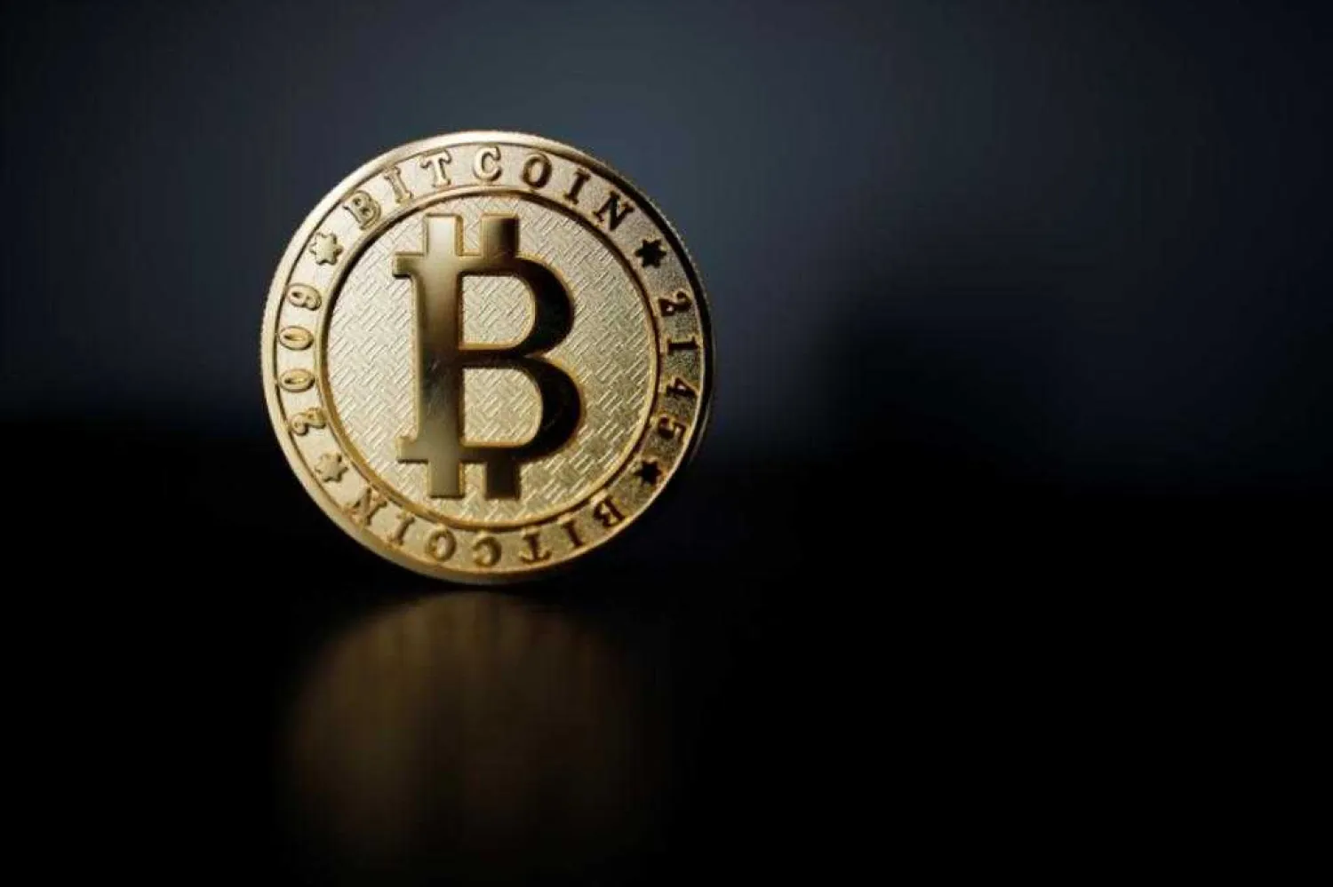 A Bitcoin (virtual currency) coin is seen in an illustration picture taken at La Maison du Bitcoin in Paris. Photo: Reuters