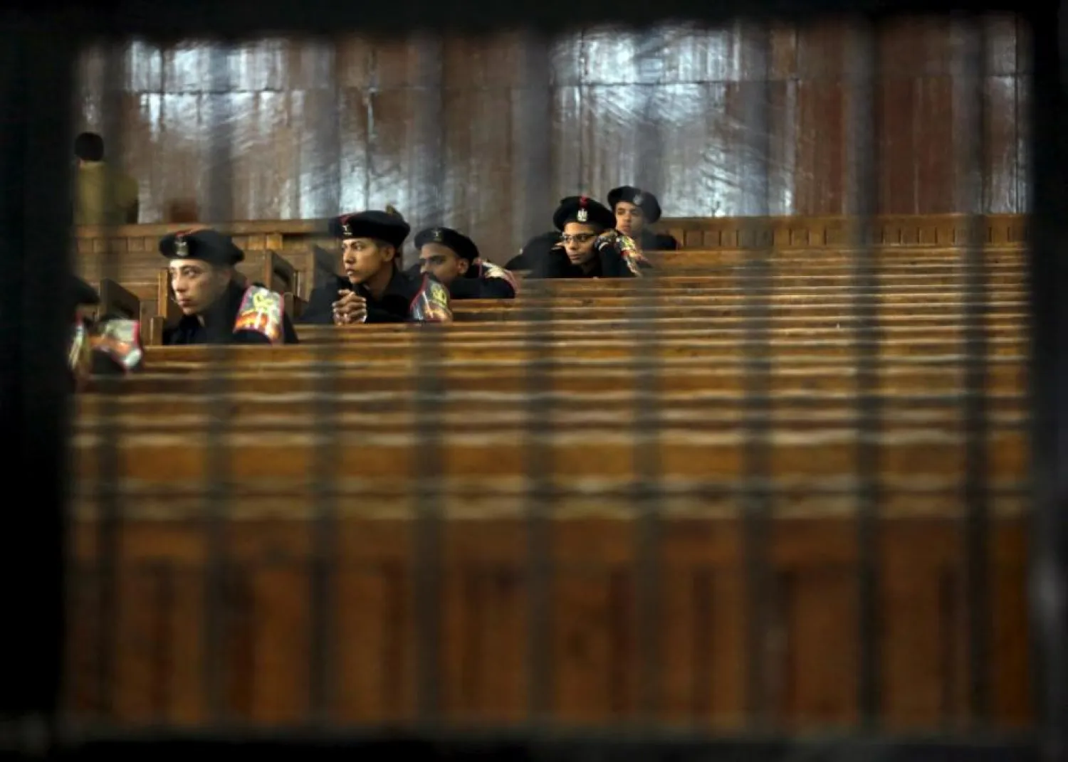 Egyptian policemen attend a trial in Cairo. (Reuters)