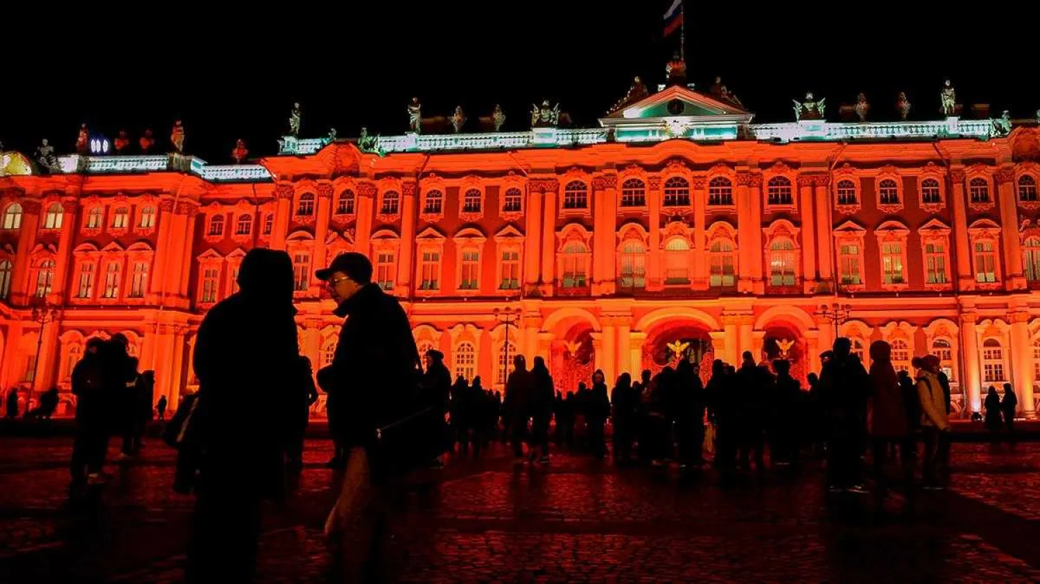 The State Hermitage Museum is seen illuminated in red for the centenary of the Bolshevik revolution in Saint Petersburg on October 25, 2017. AFP