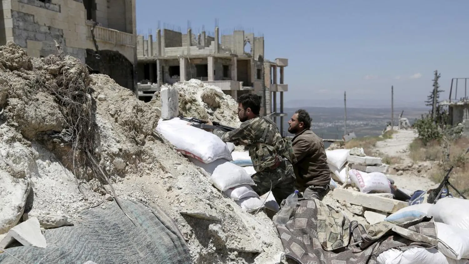 Ahrar Al-Sham fighters are seen taking positions in Jabal Al Arbaeen, Idlib province, on November 12, 2016. (Reuters)