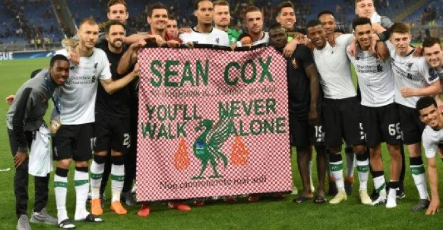 لاعبو ليفربول يتضامنون مع المشجع شون كوكس (أ.ف.ب)