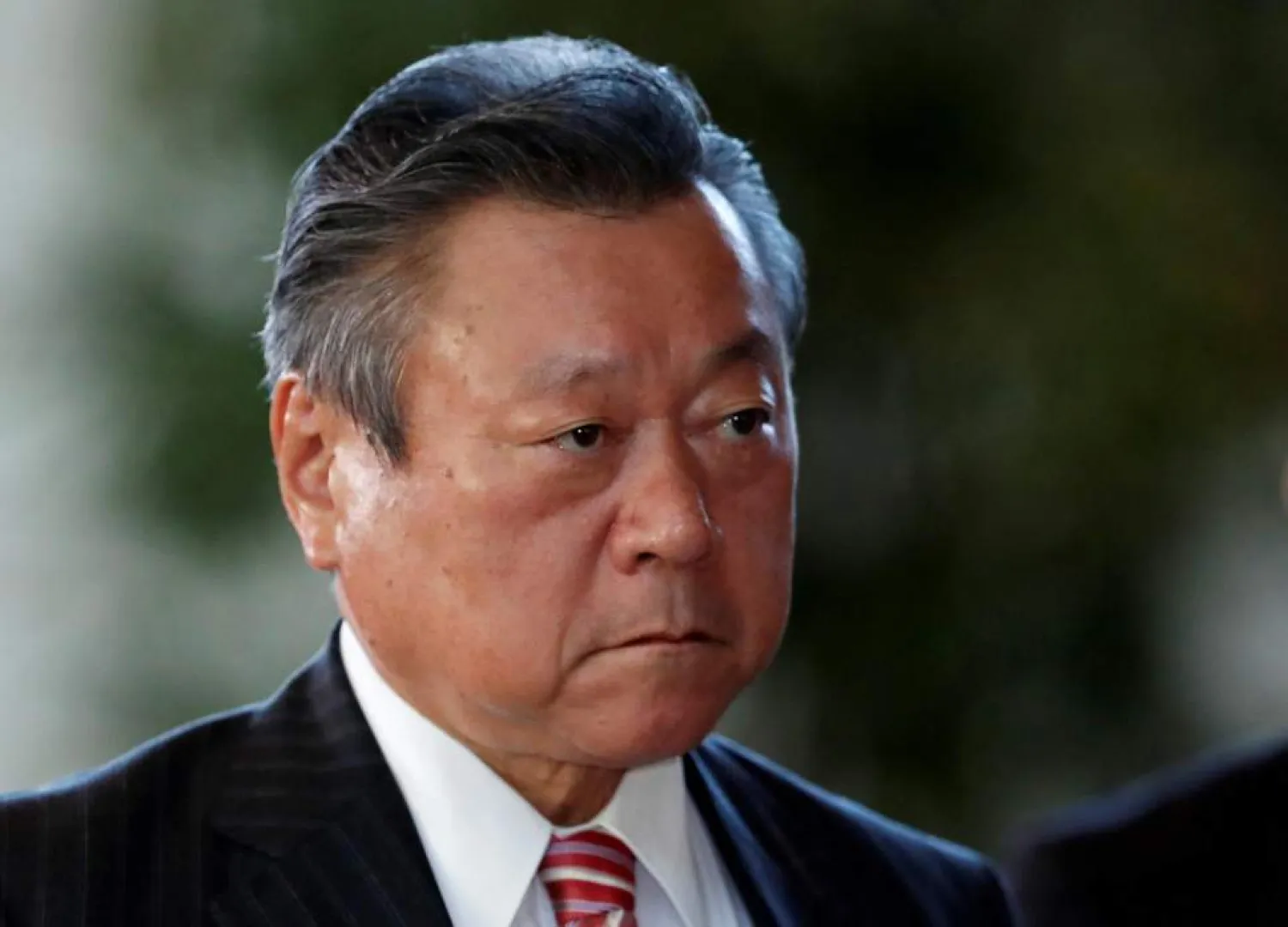 Japan's new Olympic Minister Yoshitaka Sakurada arrives at
Prime Minister Shinzo Abe's official residence in Tokyo. (
REUTERS/Issei Kato )
