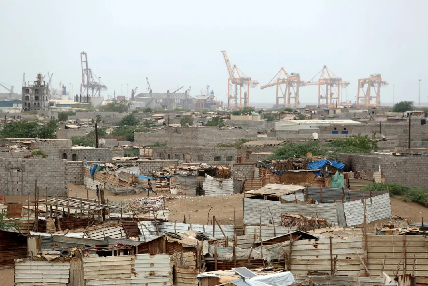 Hodeidah port's cranes are pictured from a nearby shantytown in Hodeidah, Yemen June 16, 2018. (Reuters)