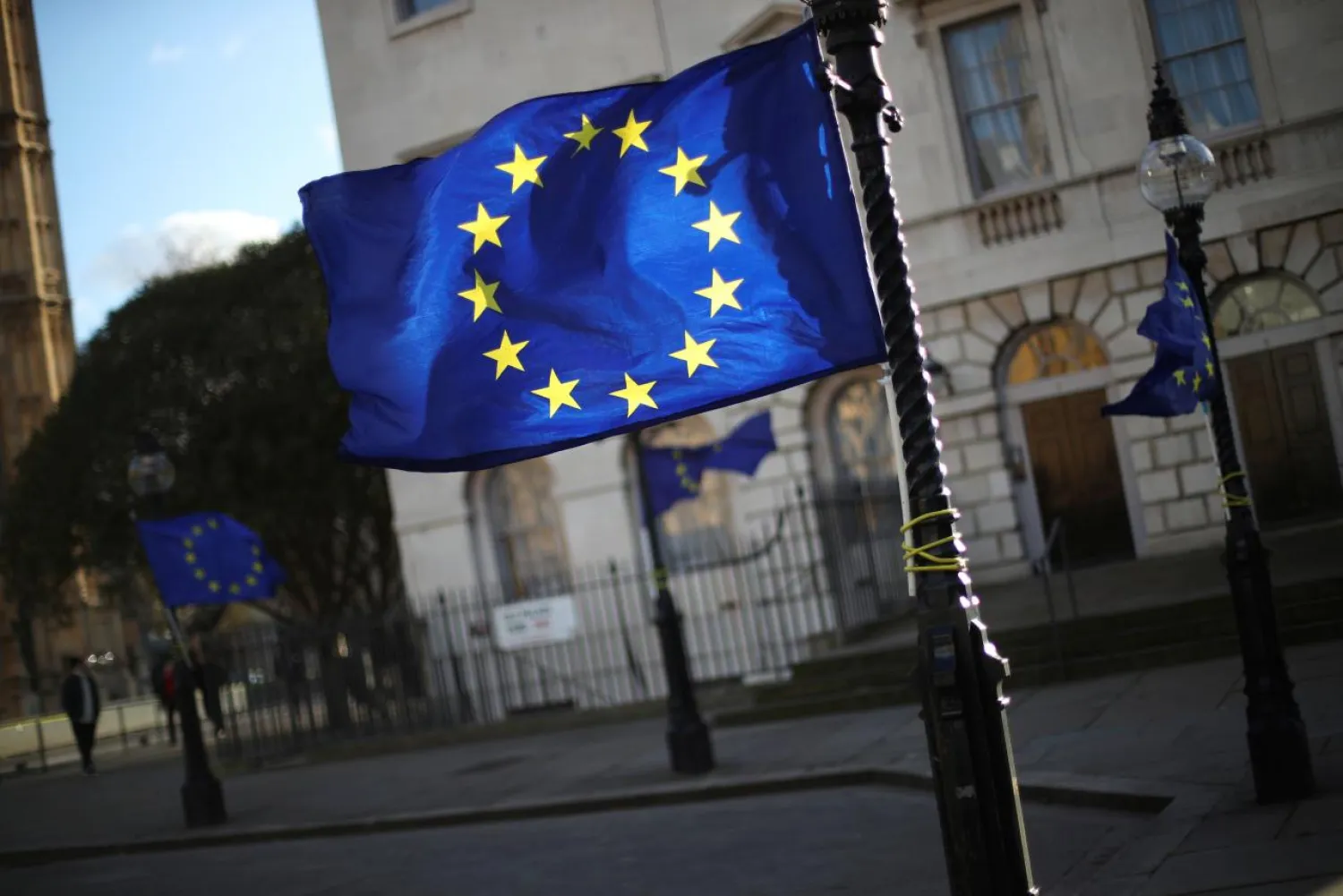 European Union flags fly from lamp posts opposite the Houses of Parliament in London, Britain, January 16, 2018. Reuters