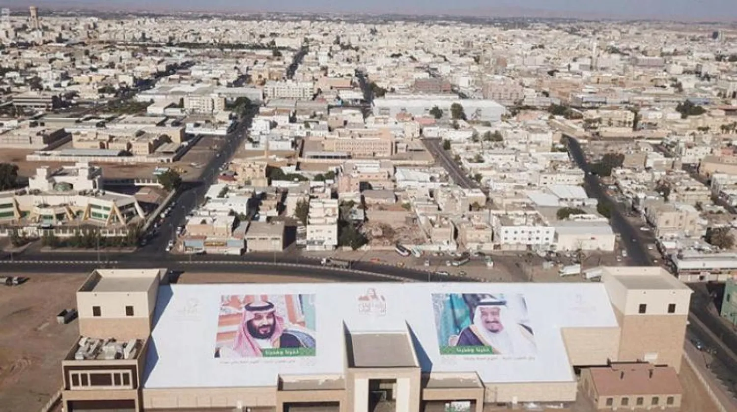 Two photos of the Custodian of the Two Holy Mosques and His Crown Prince at the entrance to the city of Waad AlShamal project, Asharq Al-Awsat