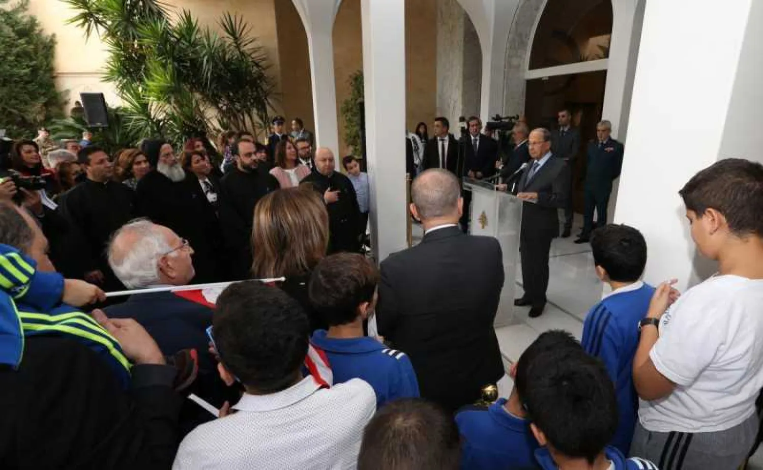 President Aoun speaks to a delegation of participants in the annual "Independence Day Race"
