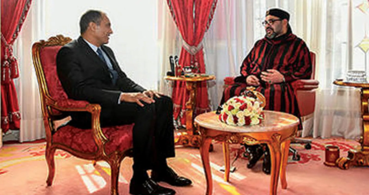 الملك محمد السادس لدى استقباله السيد أحمد رضى الشامي