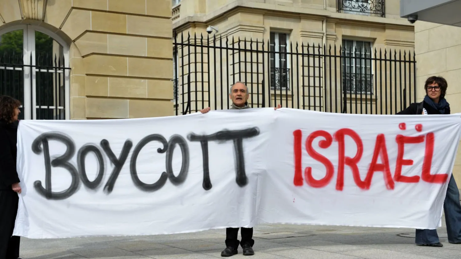 Protesters carrying banner calling for the boycott of Israel (File Photo: AFP)
