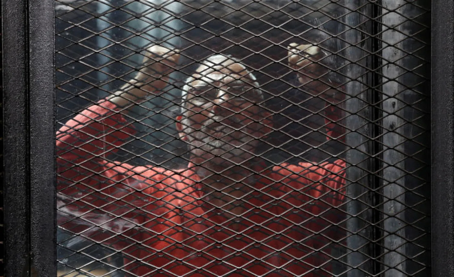 مرشد «الإخوان» محمد بديع خلف القضبان (رويترز)