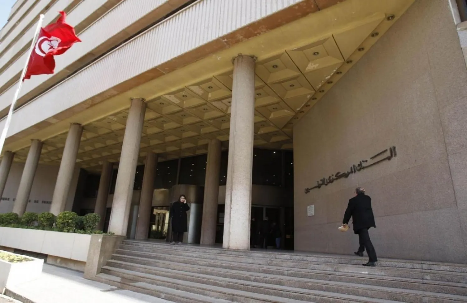 A man walks towards the Central Bank in Tunis. (Reuters)
