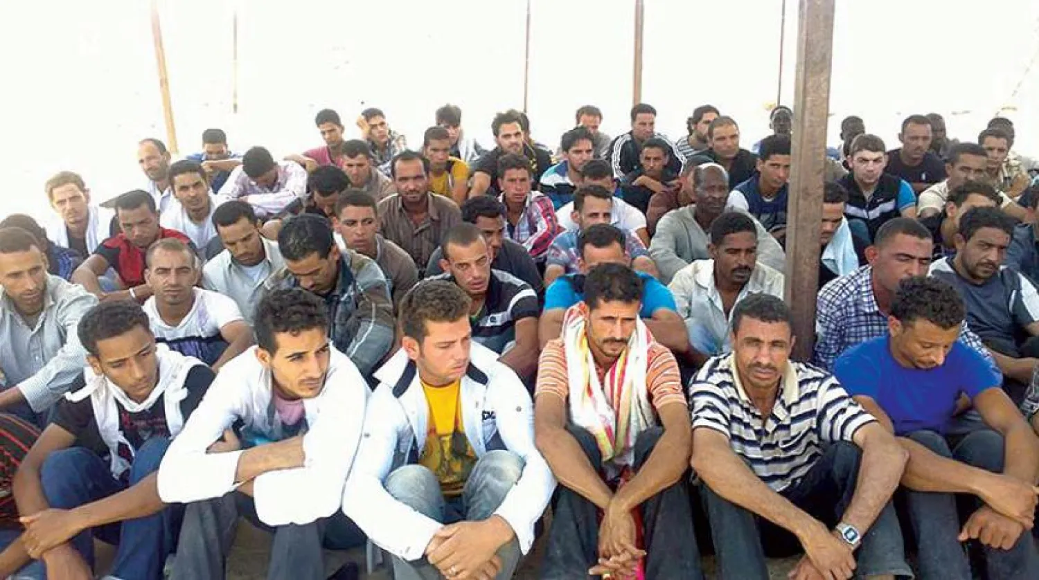A group of Egyptian migrants arrested on the border with Libya. Asharq Al-Awsat