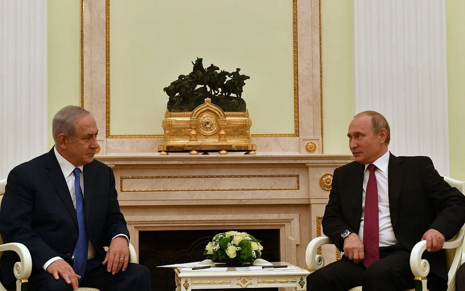 Russian President Vladimir Putin (R) speaks with Israeli Prime Minister Benjamin Netanyahu during a meeting in Moscow on July 11, 2018. (Photo by AFP)