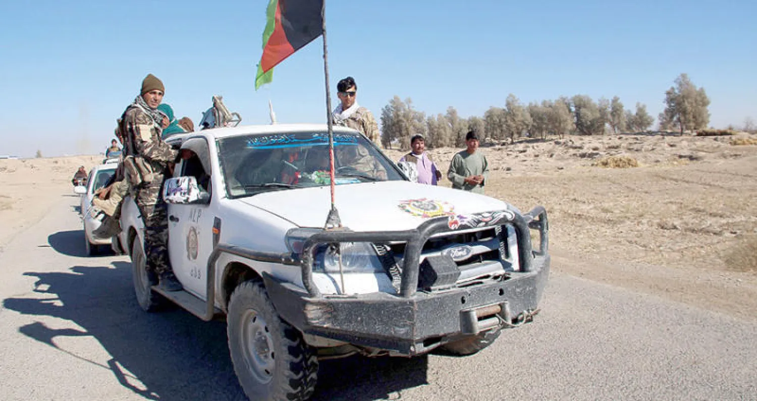 قوات للحكومة الأفغانية في ولاية هلمند بغرب البلاد أمس (إ.ب.أ)