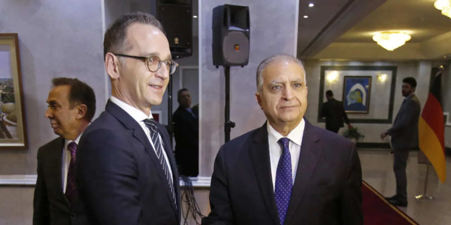 وزير الخارجية العراقي محمد علي الحكيم  خلال لقائه نظيره الألماني هيكو ماس في بغداد (أ.ب)