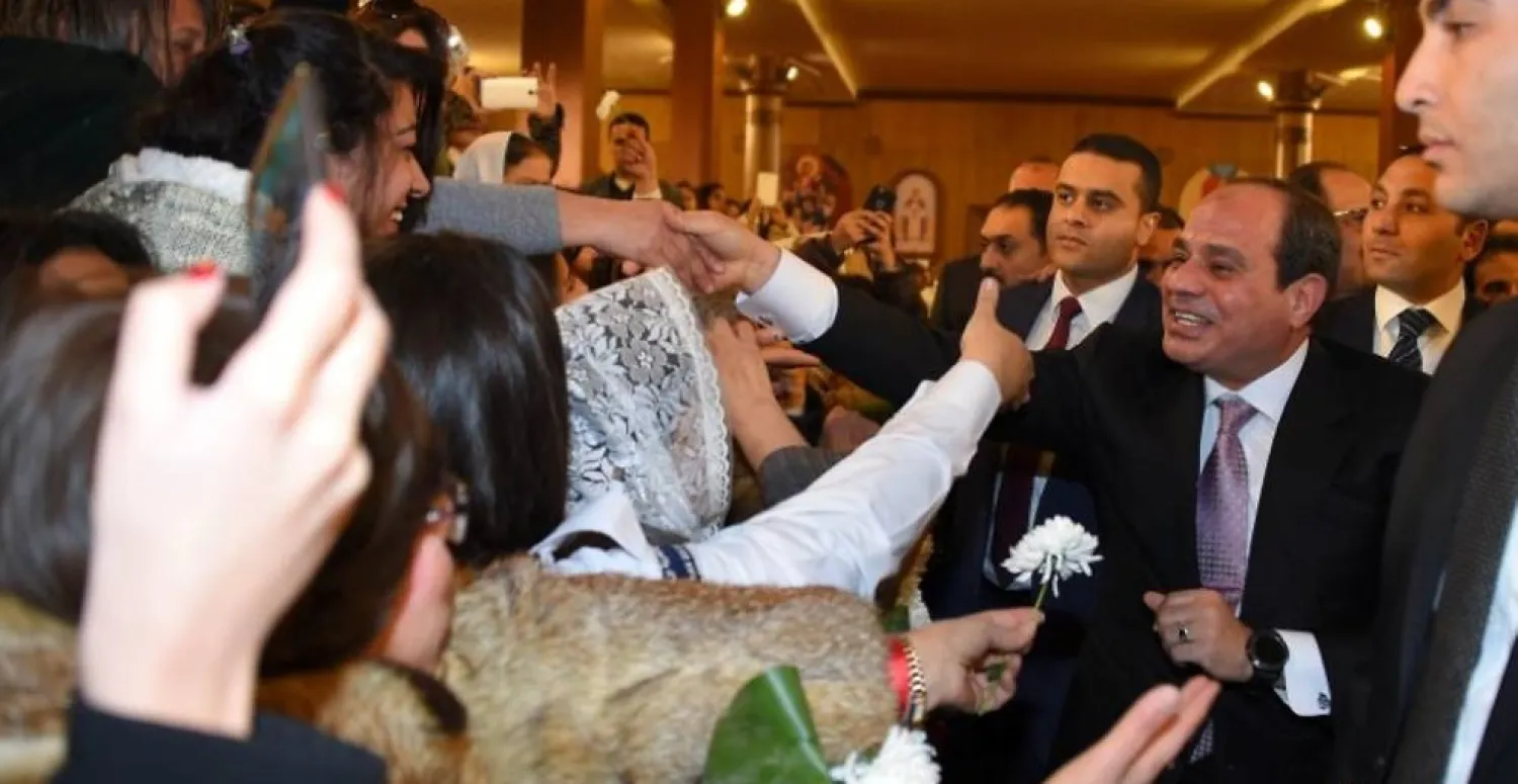 Egyptian President Abdel Fattah al-Sisi (R) greets faithful at the new Coptic Cathedral "The Nativity of Christ" in the new administrative capital, 45km east of Cairo, Egypt, January 6, 2018 in this handout picture courtesy of the Egyptian Presidency. The Egyptian Presidency/Handout via REUTERS