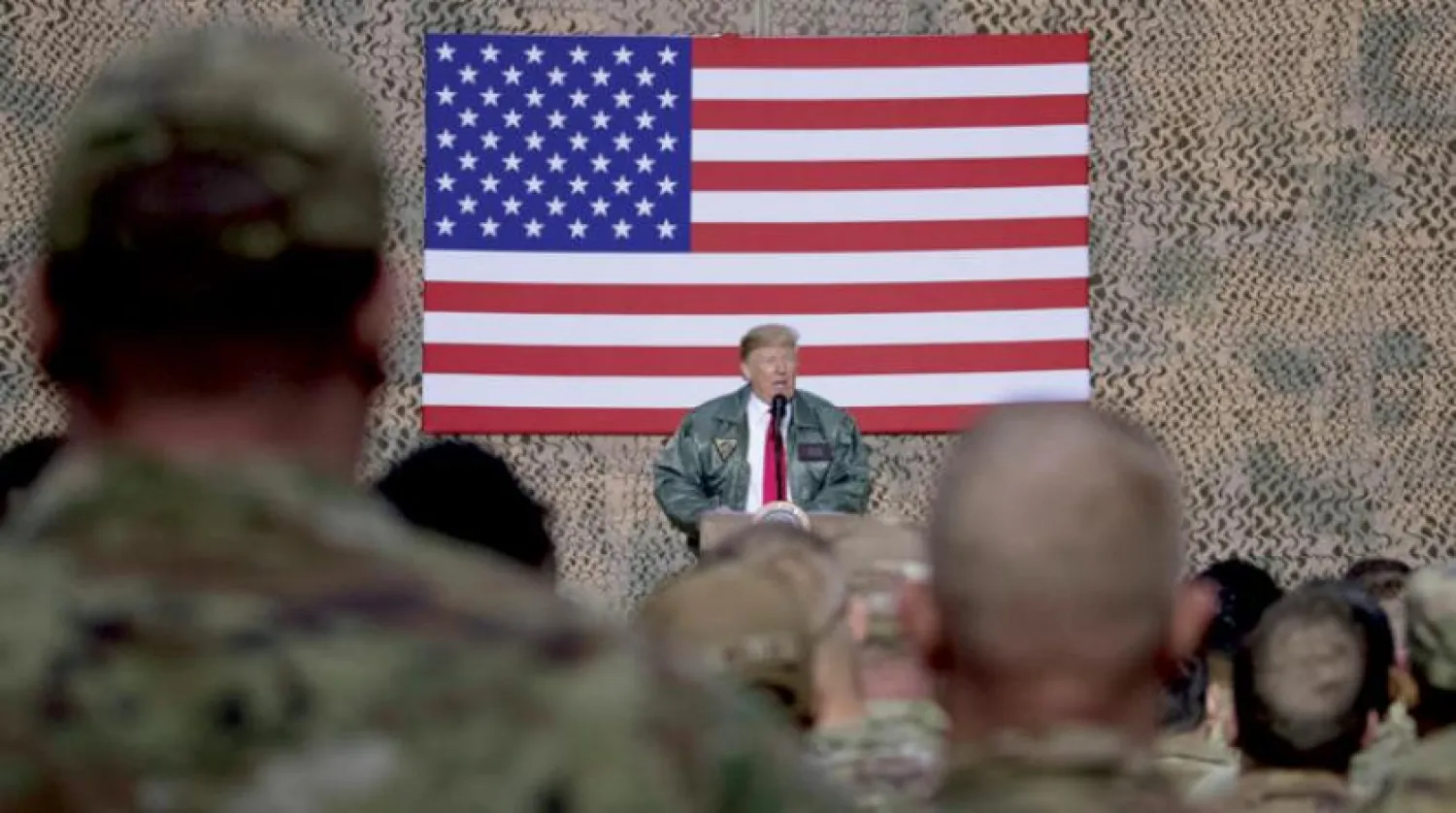 ABD Başkanı Donald Trump Çarşamba günü Irak’ın batısındaki Ayn el-Esed üssünü ziyaret ettiği sırada konuşma yapıyor (AP)